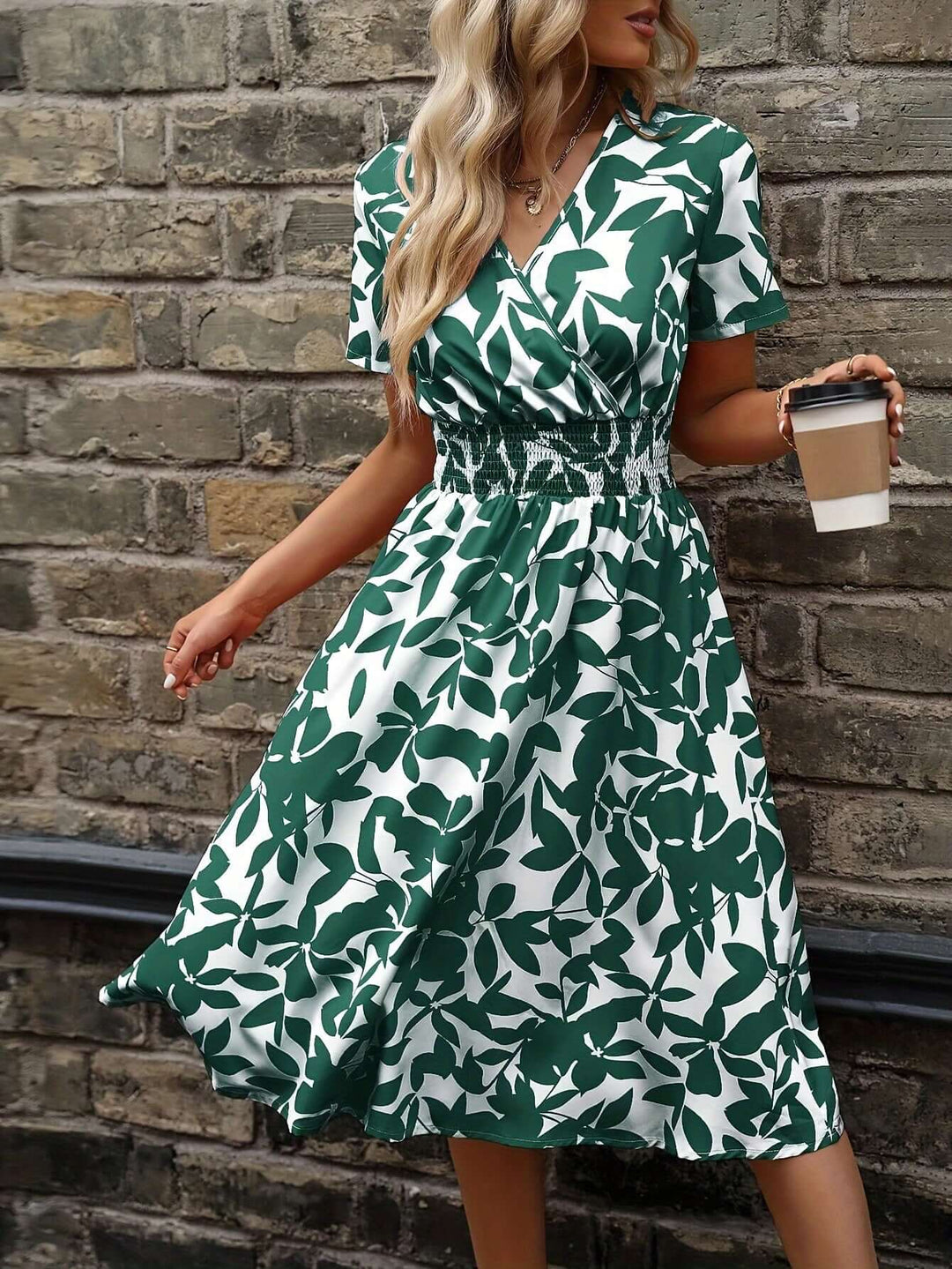 Model wearing a comfortable women's floral midi dress with smocked bodice. Great for spring fashion.