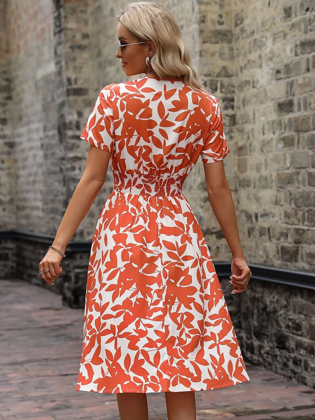 Beautiful women's smocked floral midi dress with puff sleeves, a perfect elegant casual summer dress.