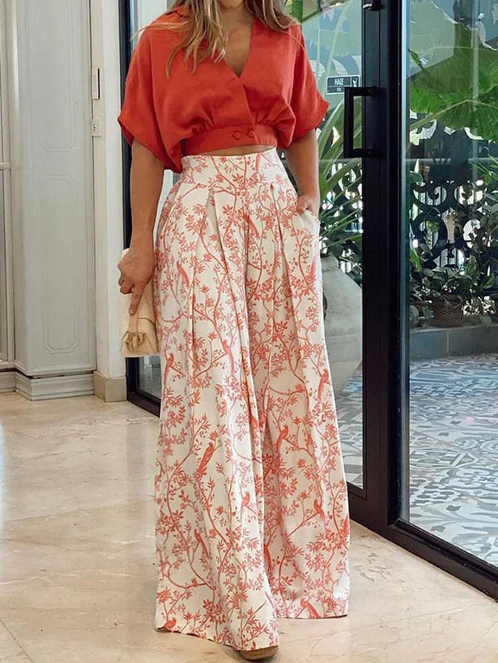 Women's floral two-piece wide-leg lounge set. Stylish & comfortable summer outfit with a vibrant print.