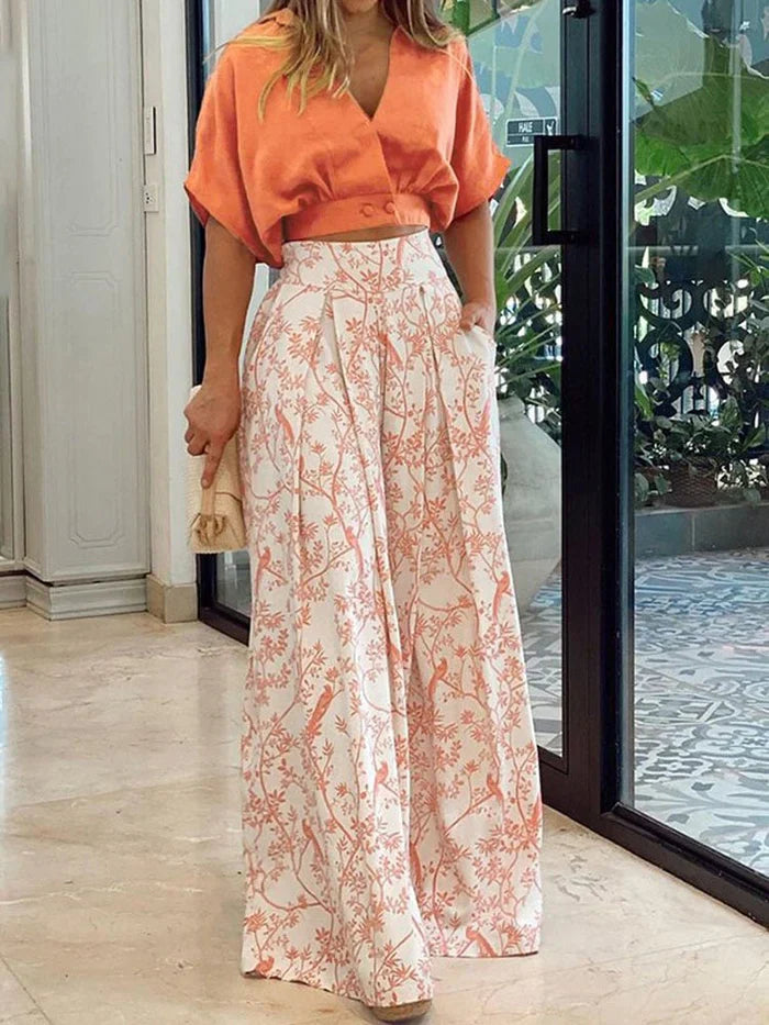 Comfortable women's floral wide-leg lounge set, a trendy two-piece for casual summer fashion & relaxation.