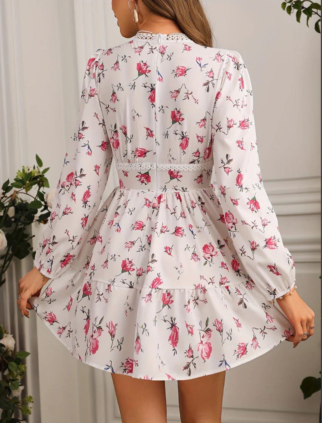 Women's elegant floral V-neck mini dress with long sleeves. Perfect party or summer occasion wear.