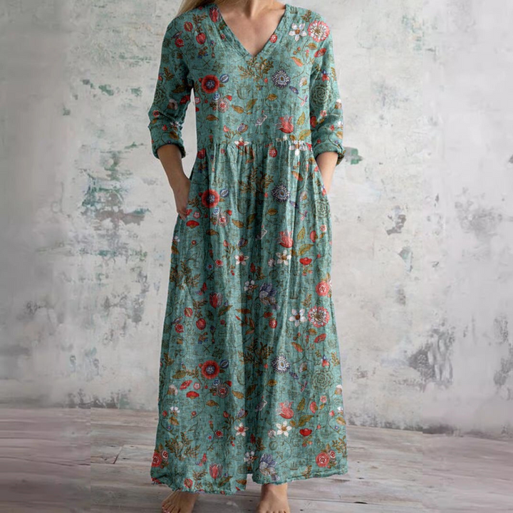 Women's V-neck floral summer dress. Elegant midi length, ideal for warm weather and a comfortable, casual look.