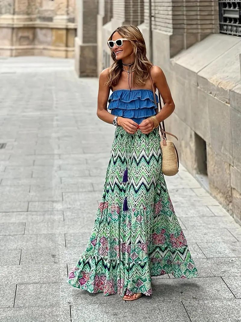 Women's flowing tiered boho maxi skirt in a vibrant print, ideal for elegant summer style.