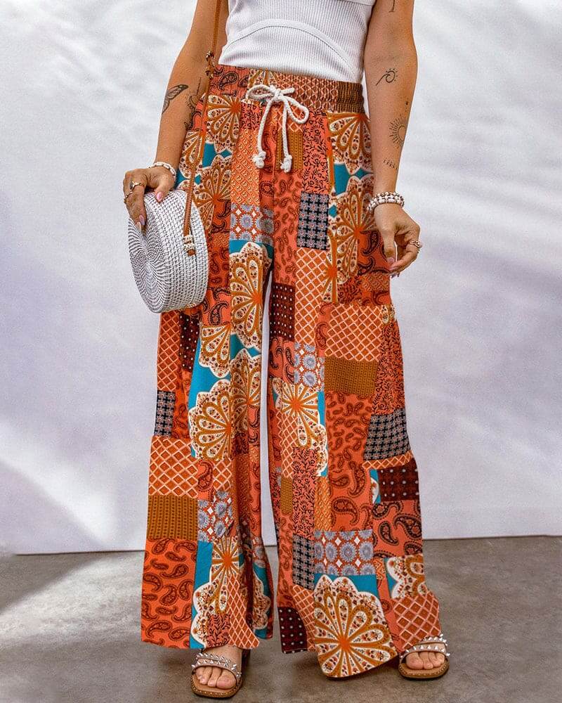 Women's flowing wide leg palazzo trousers in a comfortable viscose blend, perfect for effortless style.