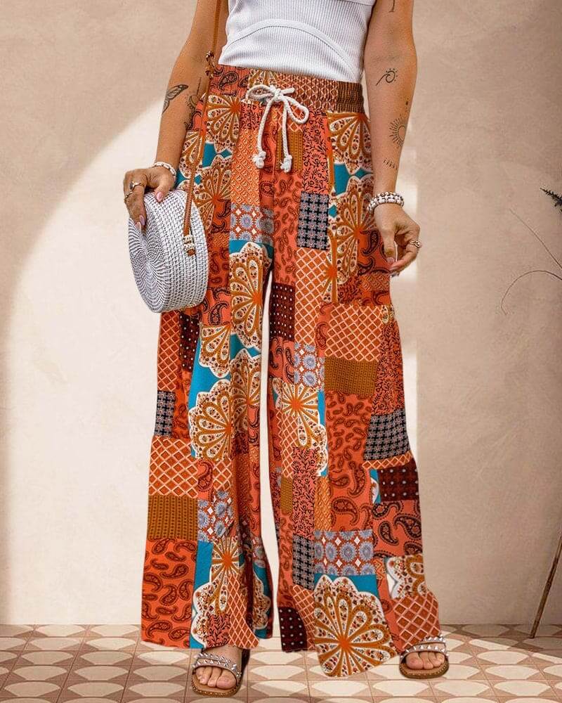 Effortless women's wide leg palazzo trousers with a flattering high waist, providing a comfortable, flowing fit.