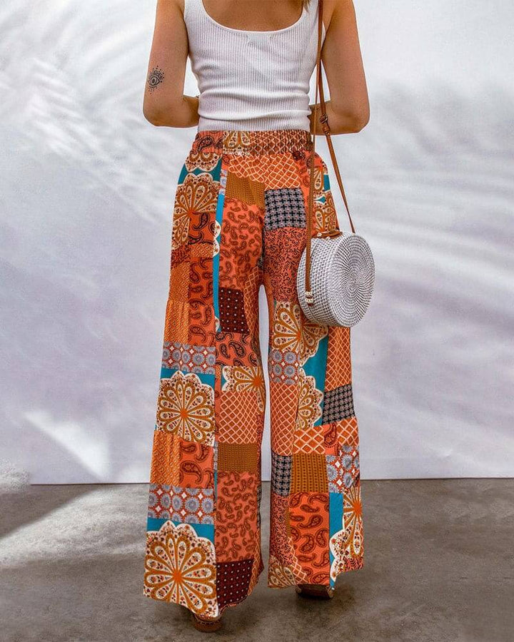Stylish women's wide leg trousers, offering a flowing silhouette and comfortable fit, perfect for any wardrobe.