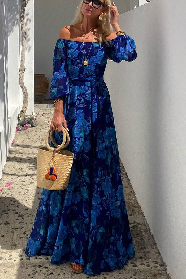 Elegant women's blue floral off-shoulder maxi dress with a flowy design, ideal for a chic summer or spring look.