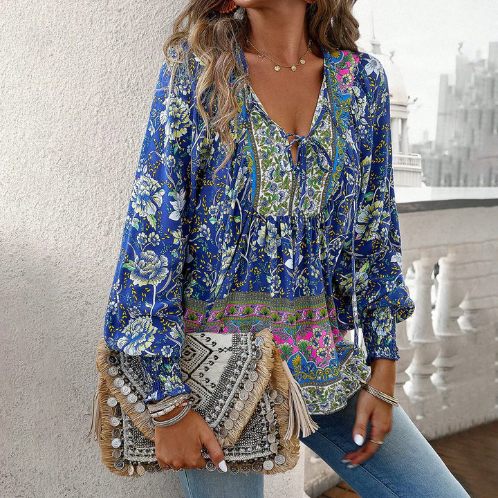 Women's flowy bohemian v-neck blouse with tie, long sleeve, floral print, relaxed fit for spring.