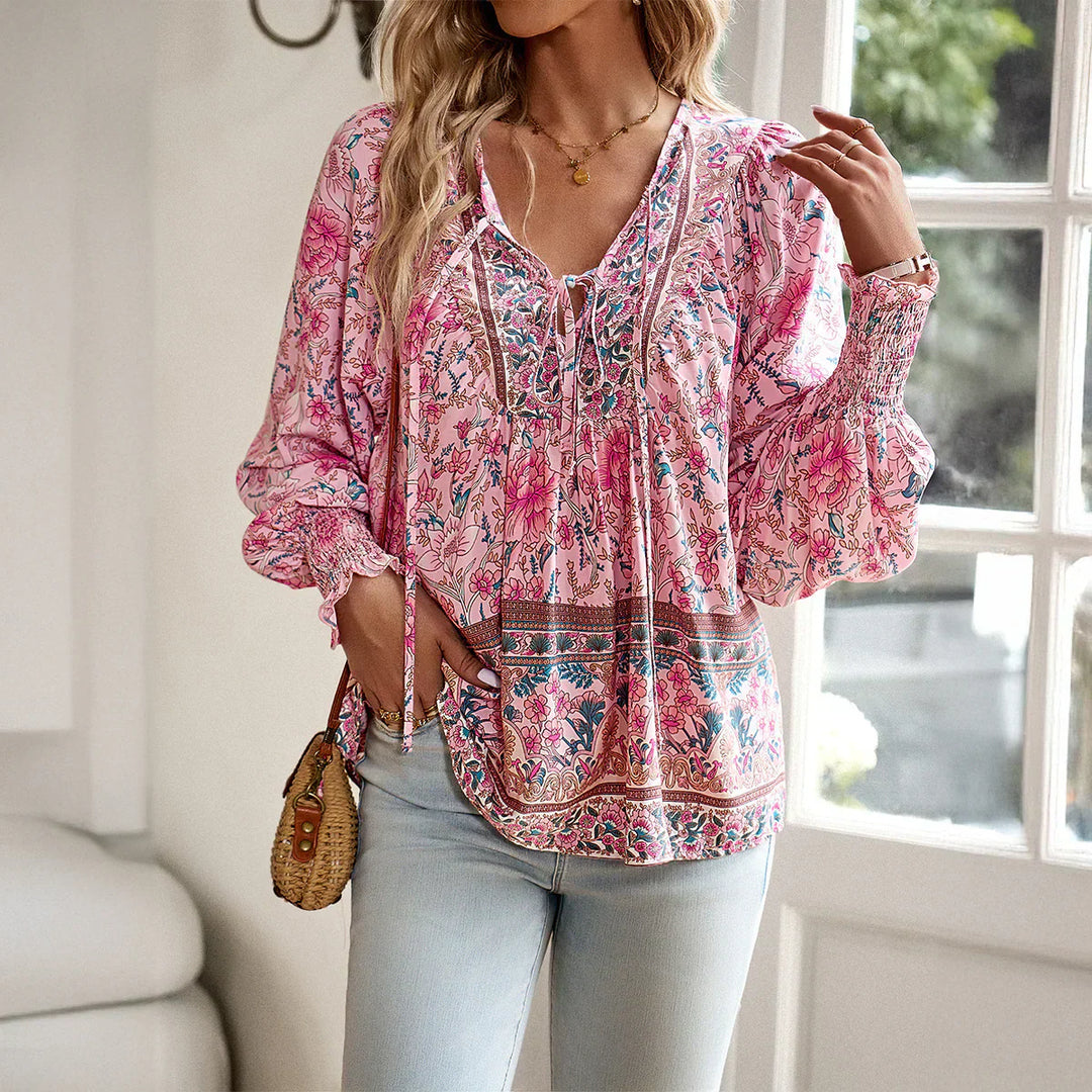 Women's long sleeve bohemian blouse, v-neck with tie. Relaxed fit floral print top for casual wear.