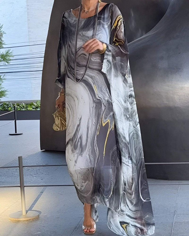 Elegant long maxi dress for women, with a flowing silhouette, perfect for weddings & holidays.