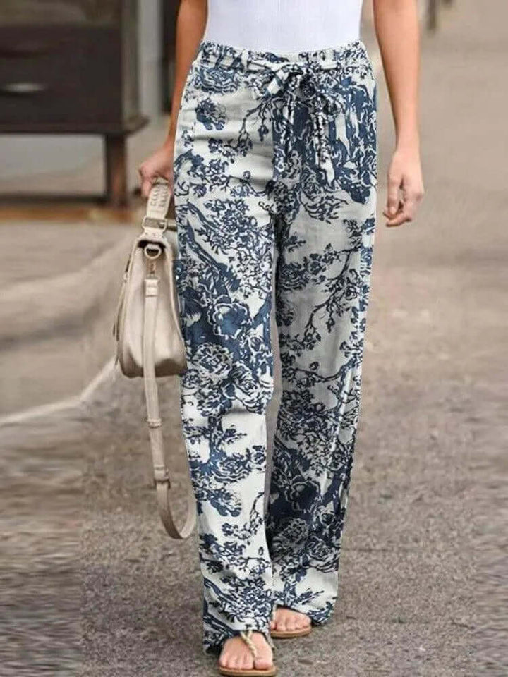 Women's flowy floral wide-leg pants. Breezy, comfortable summer style for casual fashion.