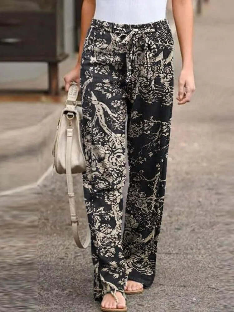 Comfortable women's floral wide-leg pants with a flowy fit, ideal for summer casual and boho fashion.