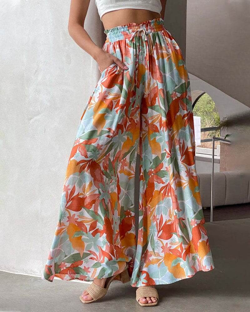 Comfortable women's flowy floral wide-leg pants with elastic waist for fashionable summer.