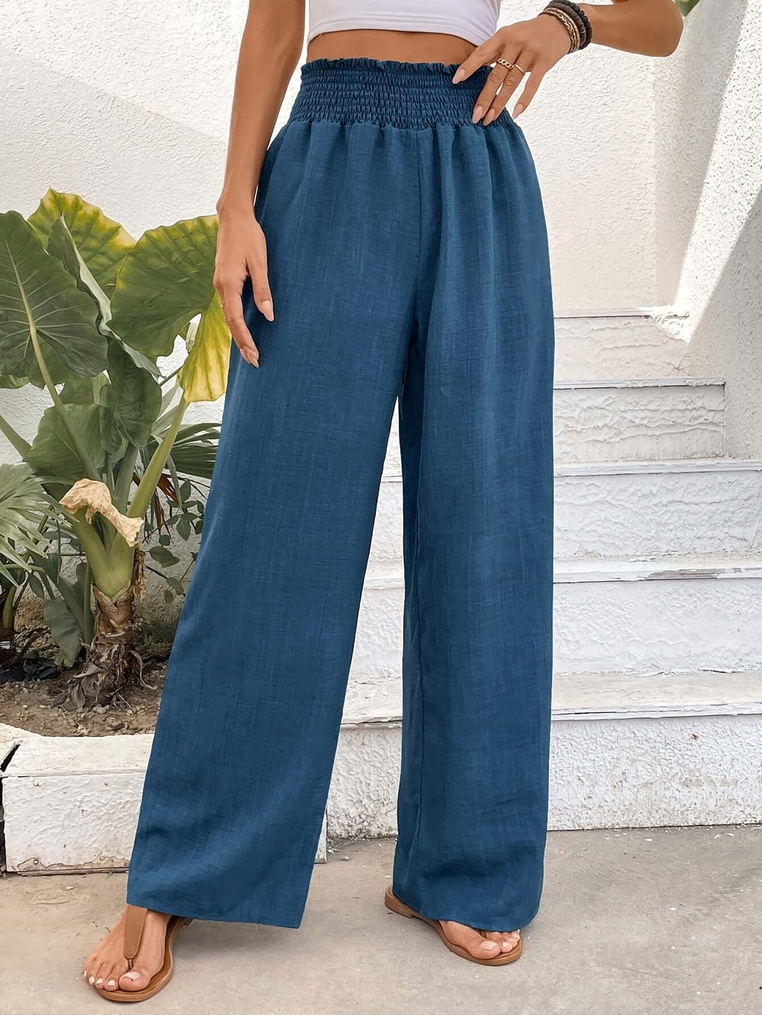 Women's flowy high-waisted wide-leg pants, offering effortless style and comfort for casual wear.