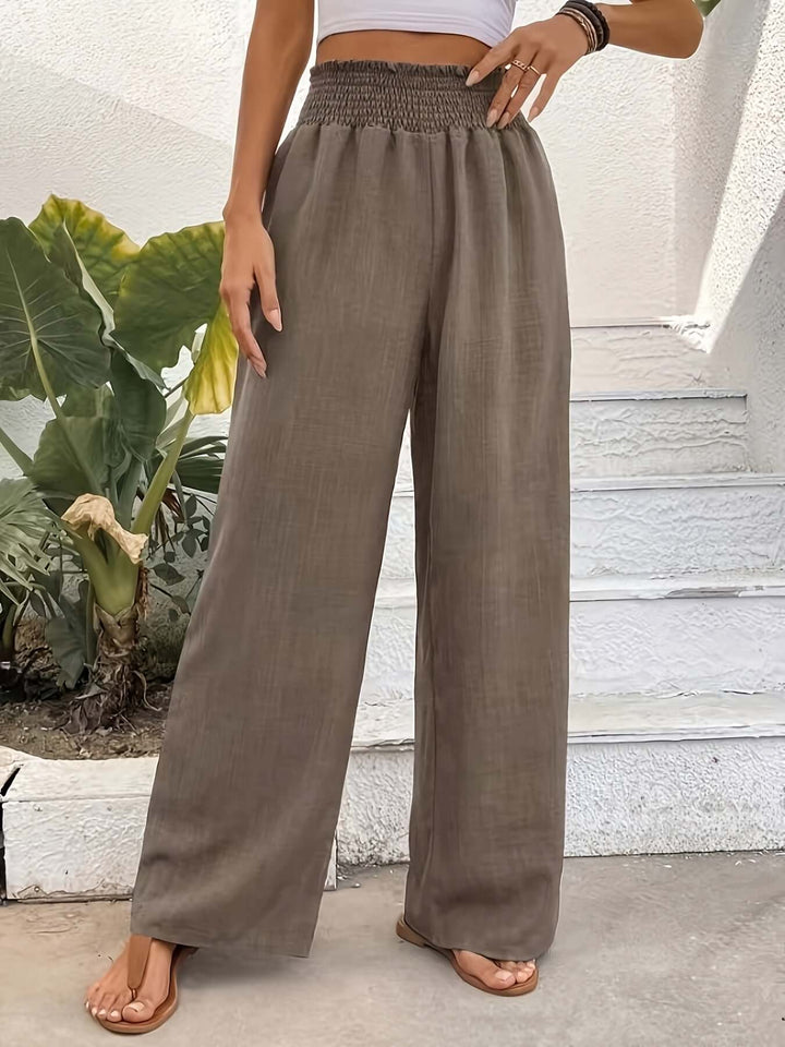 Navy blue & brown flowy wide-leg pants with a high waist. Comfortable and stylish for versatile casual wear.