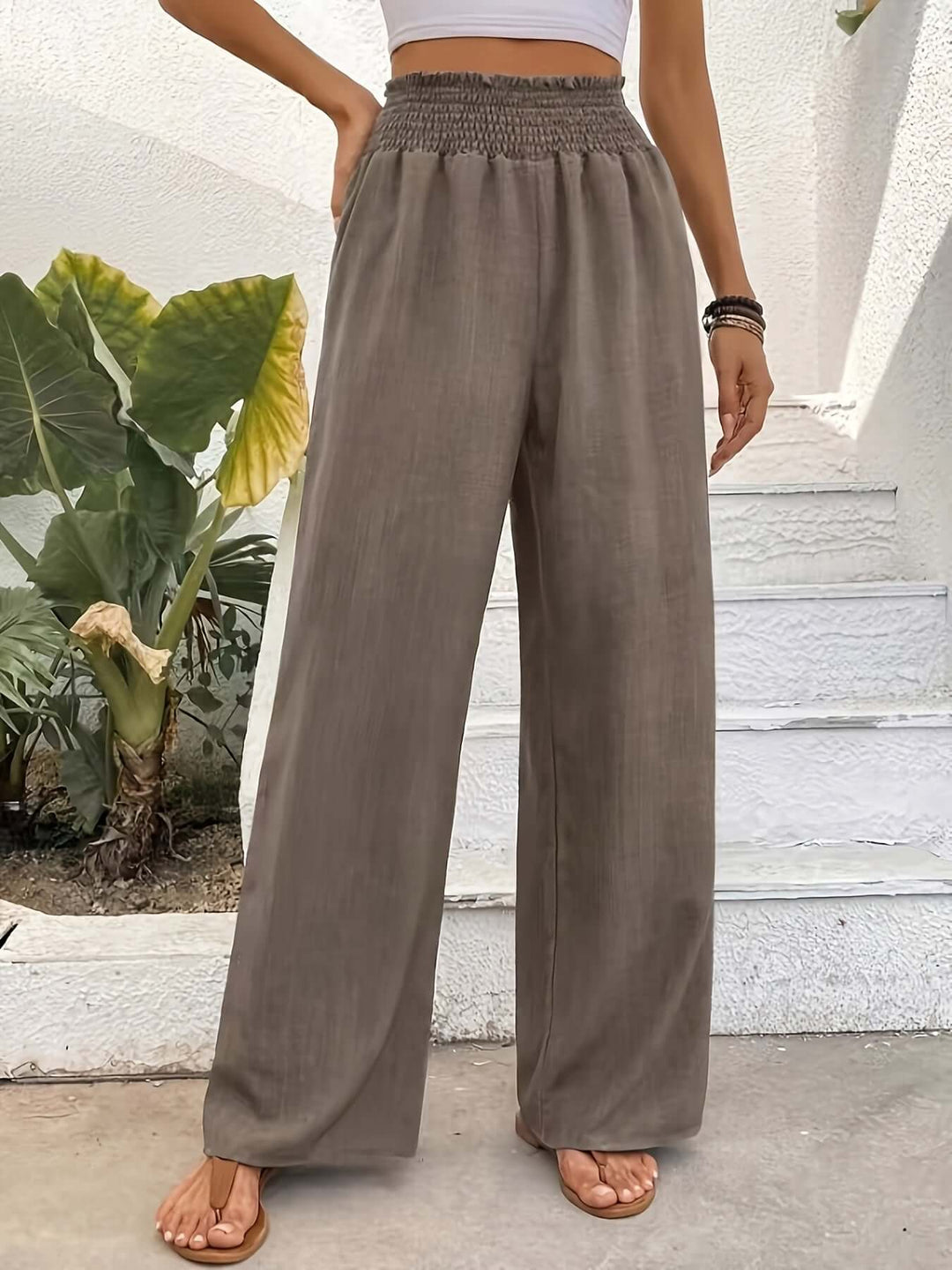 Lightweight polyester blend flowy wide-leg pants with a high waist for chic, versatile summer & spring fashion.