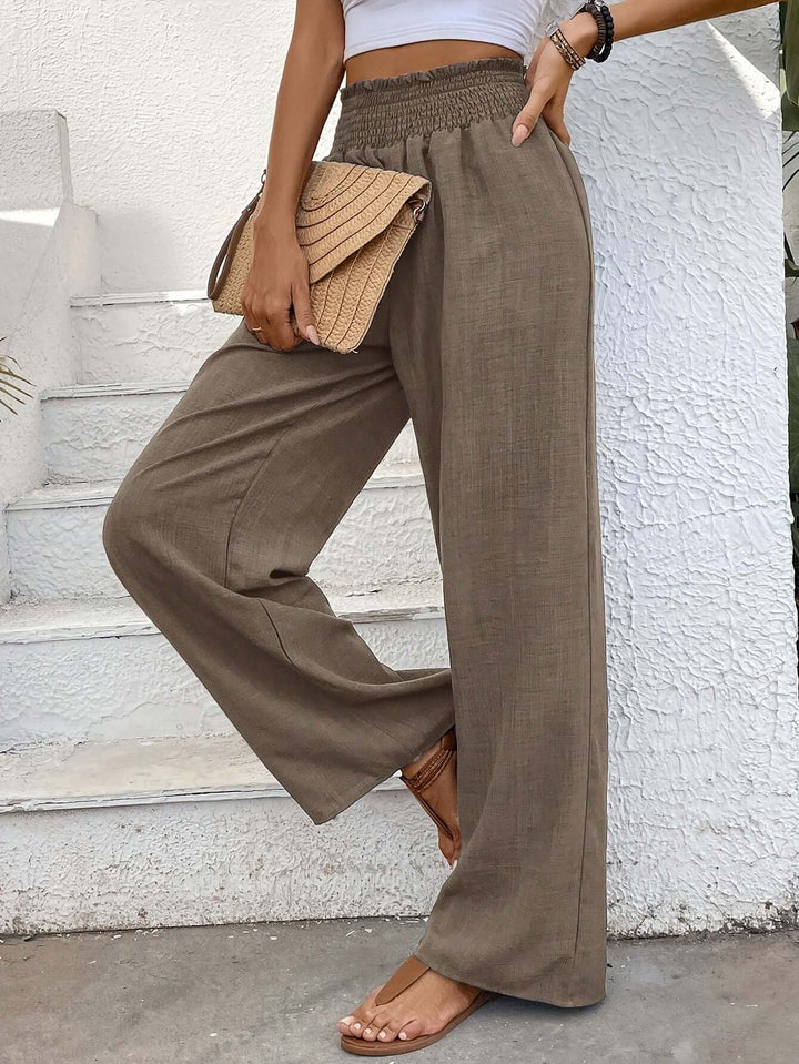 Chic high-waisted wide-leg pants with a flowy fit, ideal for versatile casual spring and summer fashion.
