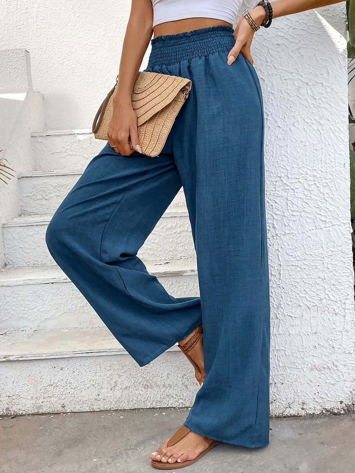 Versatile navy blue flowy wide-leg pants, high-waisted for comfort. Perfect for casual summer outfits.