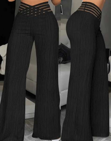 Comfortable women's wide-leg pants, high-waisted and flowy, offering an elegant fit.
