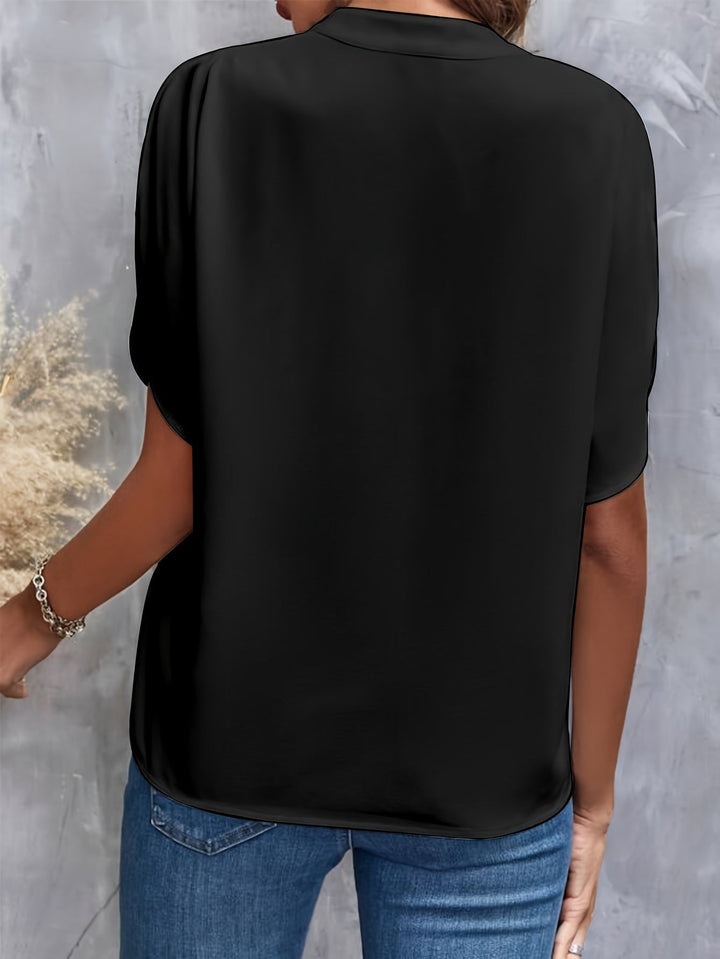 Stylish blue flowy blouse, offering comfort and an elegant look for any occasion.