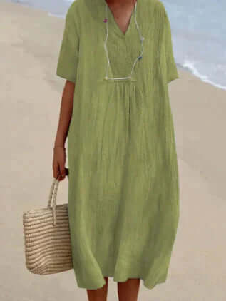 Comfortable women's flowy linen midi dress, breathable fabric for relaxed summer fashion & effortless style.