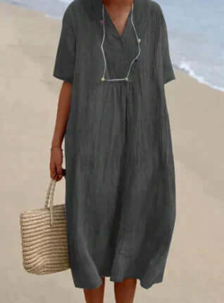 Breathable women's flowy linen midi dress, relaxed fit for comfortable and stylish summer fashion.