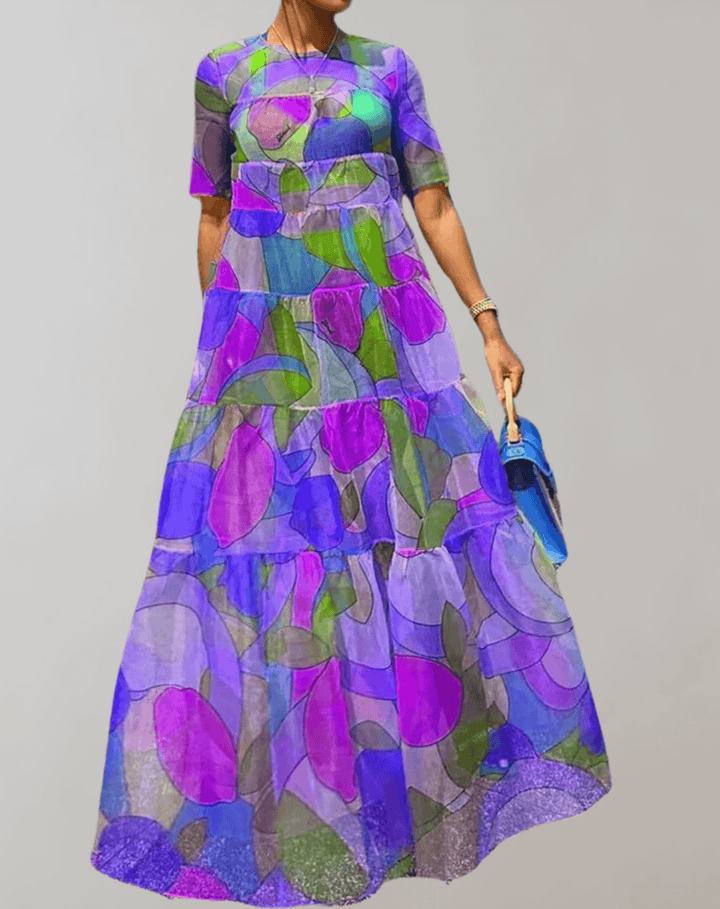 Casual yet elegant women's long sleeve printed dress. Features a vibrant floral print and flowy design.