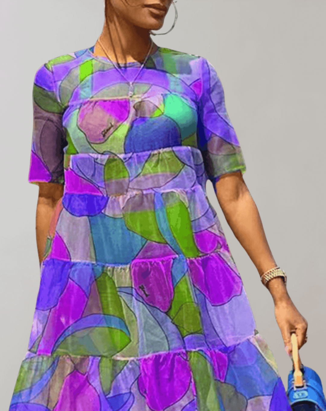 Spring/summer women's long sleeve flowy dress. Features a chic floral print, perfect for elegant comfort.