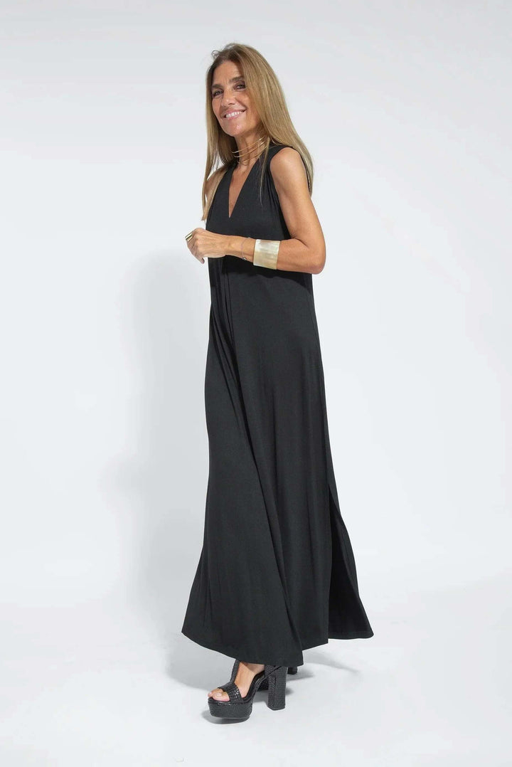 Stylish women's long flowy maxi dress and cardigan. Versatile two-piece set for spring fashion.