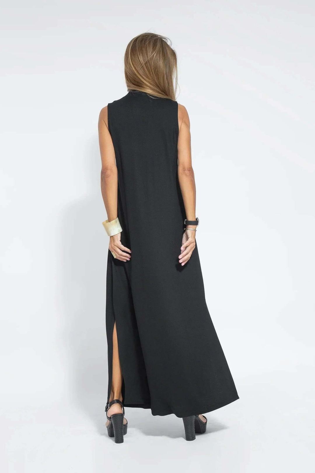 Flowy maxi dress for women, paired with a stylish cardigan. Versatile casual fashion for any occasion.