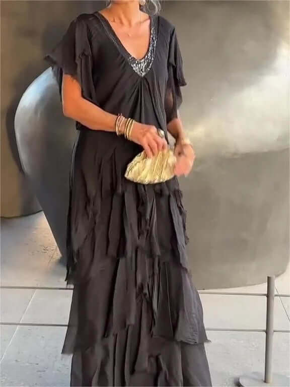 Lightweight women's flowy midi summer dress with elegant long sleeves. Ideal vacation or everyday wear.