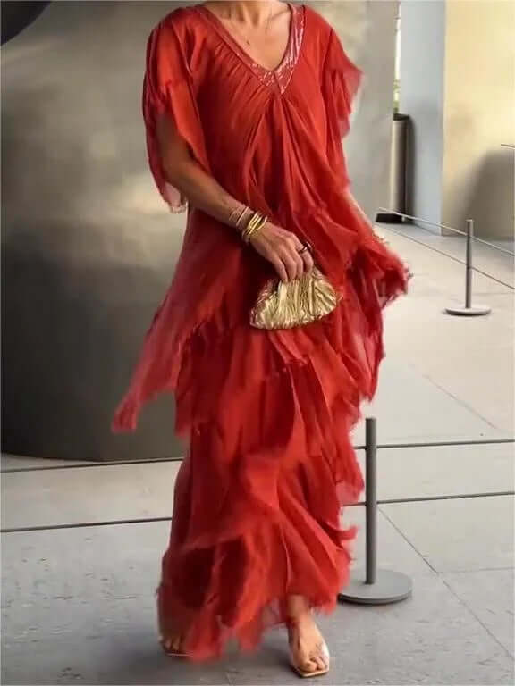 Stylish women's flowy midi dress with elegant long sleeves. Comfortable summer wear for any occasion.