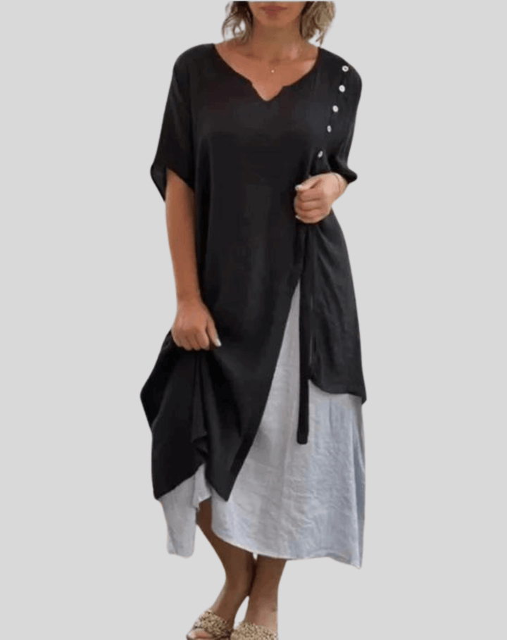 Stylish women's V-neck button-down flowy summer dress, showcasing its comfortable fabric and midi length.