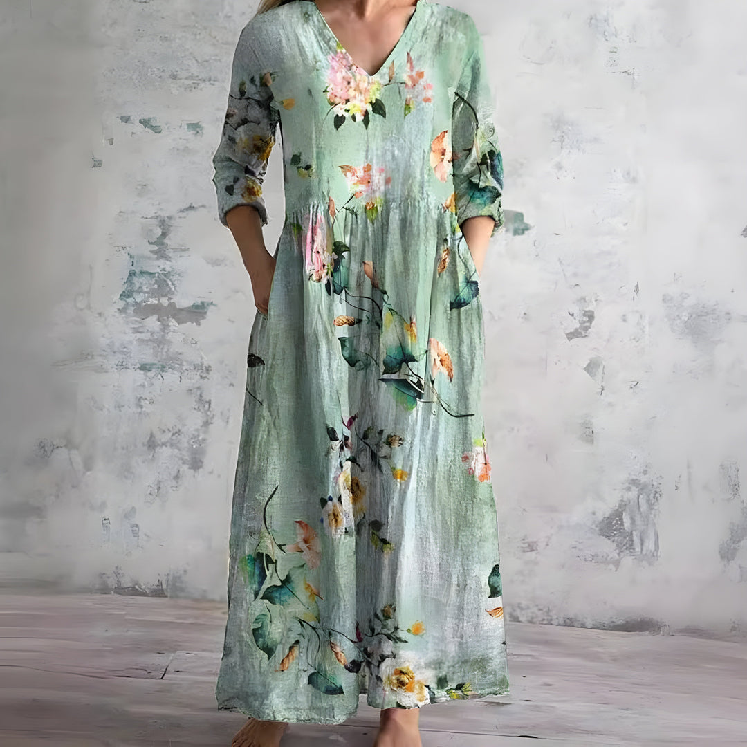 Vibrant floral print women's maxi dress. Flowy V-neck design, ideal for summer casual & beach.
