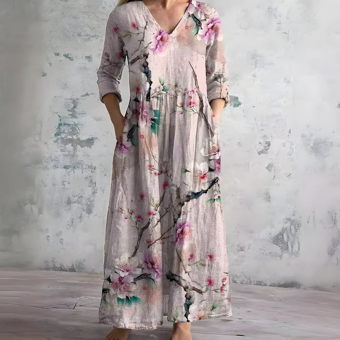 Comfortable women's flowy V-neck floral maxi dress. Stylish for summer, beach, or casual outings.