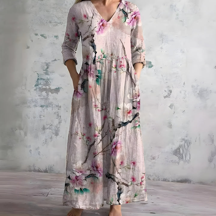 Comfortable women's flowy V-neck floral maxi dress. Stylish for summer, beach, or casual outings.
