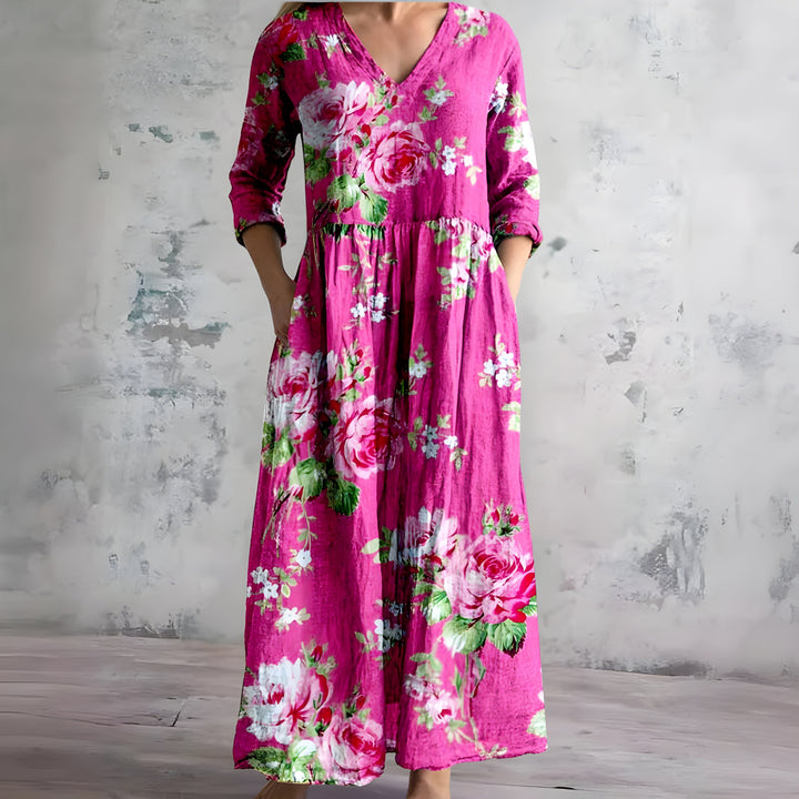 Women's elegant floral summer maxi dress. Features a flowy V-neck for casual & beach comfort.