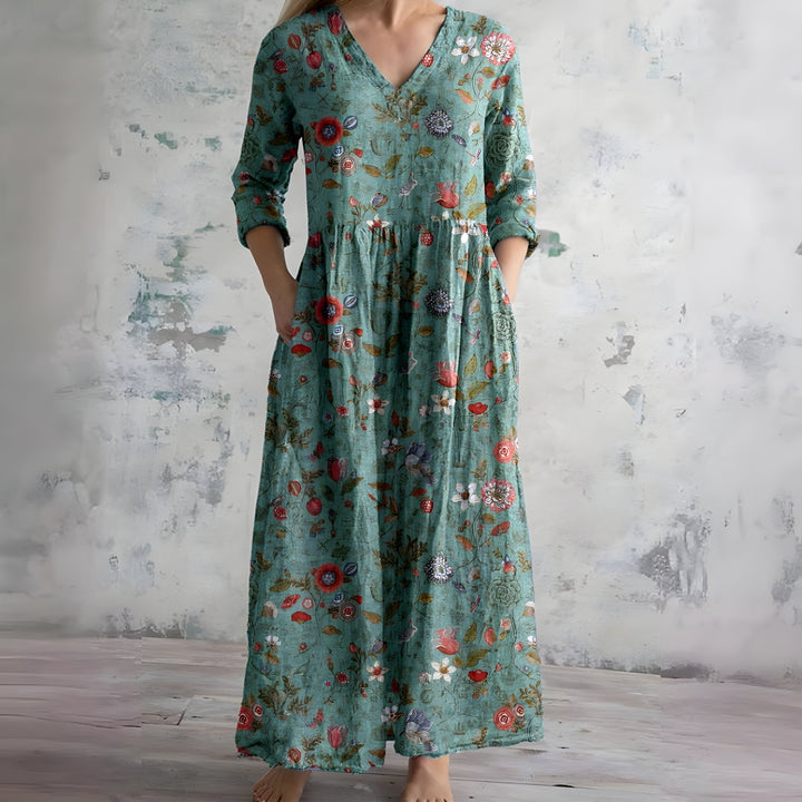 Beautiful floral summer maxi dress for women. V-neck, flowy fabric, ideal for beach & casual comfort.