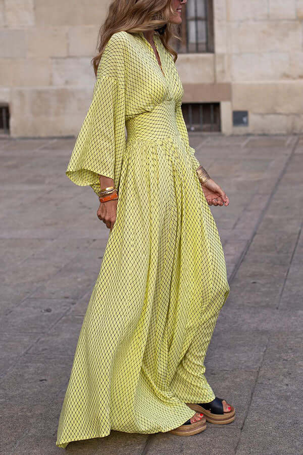Women's flowy V-neck midi dress, perfect for effortless style and comfort. Elegant summer fashion.