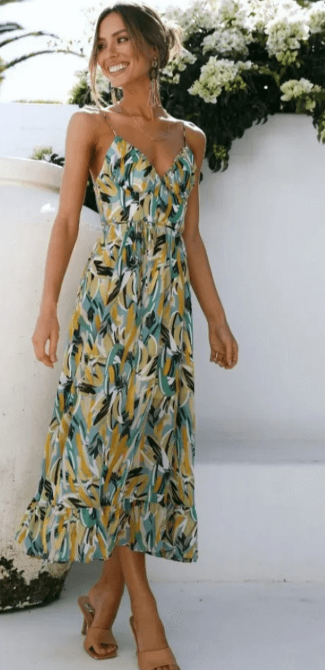 Women's flowy V-neck midi dress with delicate spaghetti straps, perfect for elegant summer casual wear.