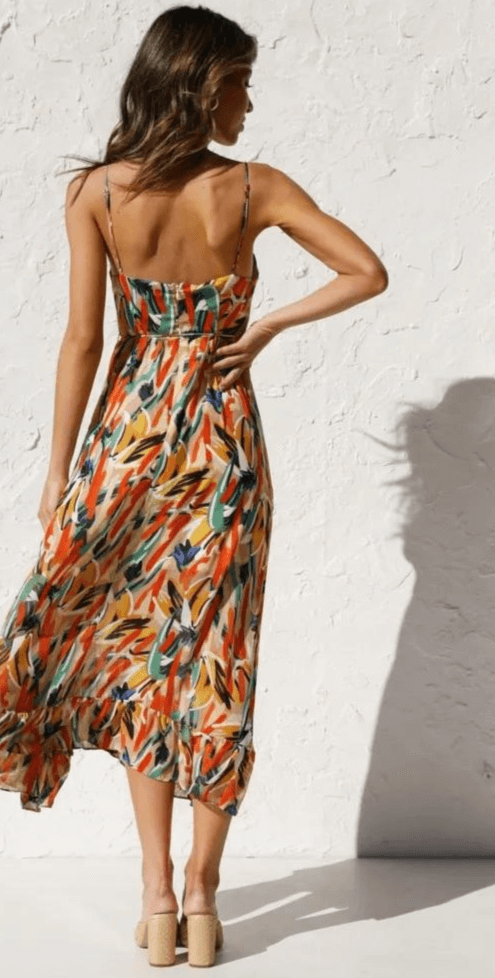 Stylish women's V-neck midi dress with thin spaghetti straps, a flowy design for versatile casual or elegant looks.