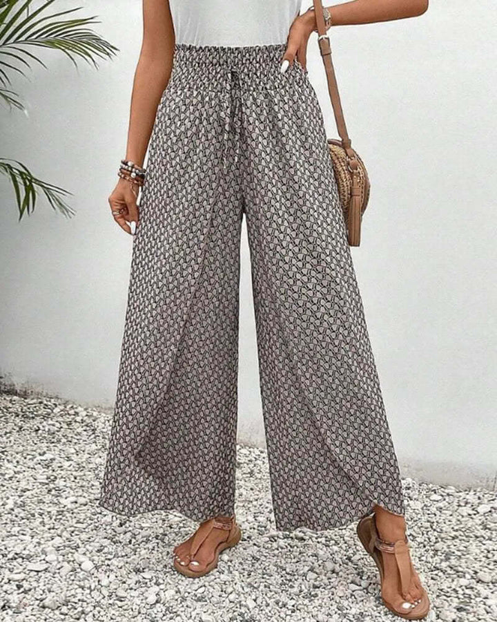 Women's flowy wide-leg palazzo trousers for effortless comfort and style.