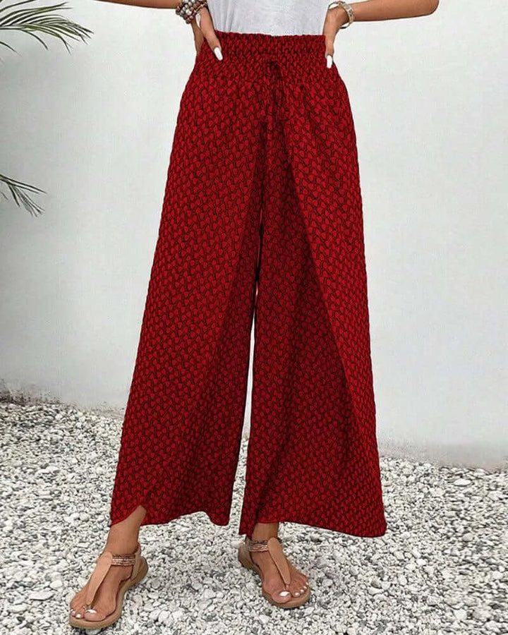 Full-length women's flowy wide-leg palazzo trousers in a comfortable design.