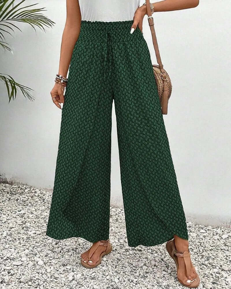 Women's flowy palazzo trousers, styled casually for a relaxed look.