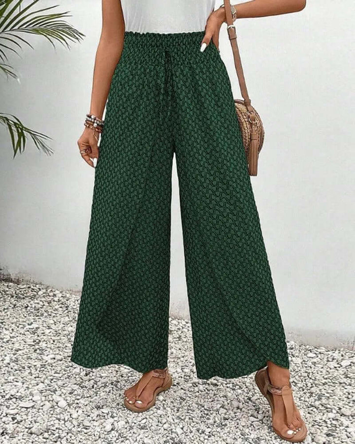 Women's flowy palazzo trousers, styled casually for a relaxed look.