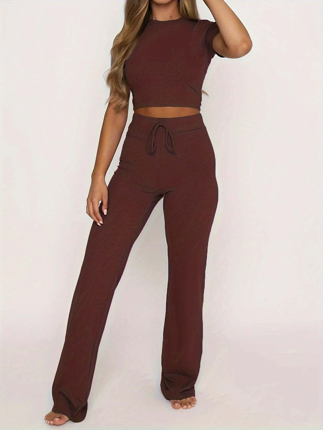 Woman wearing casual chic flowy wide leg pants. Comfortable everyday wear.