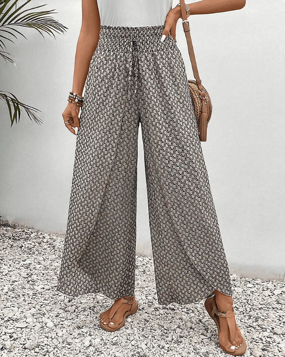 Women's flowy wide-leg pants in a comfortable viscose blend, perfect for stylish casual wear.