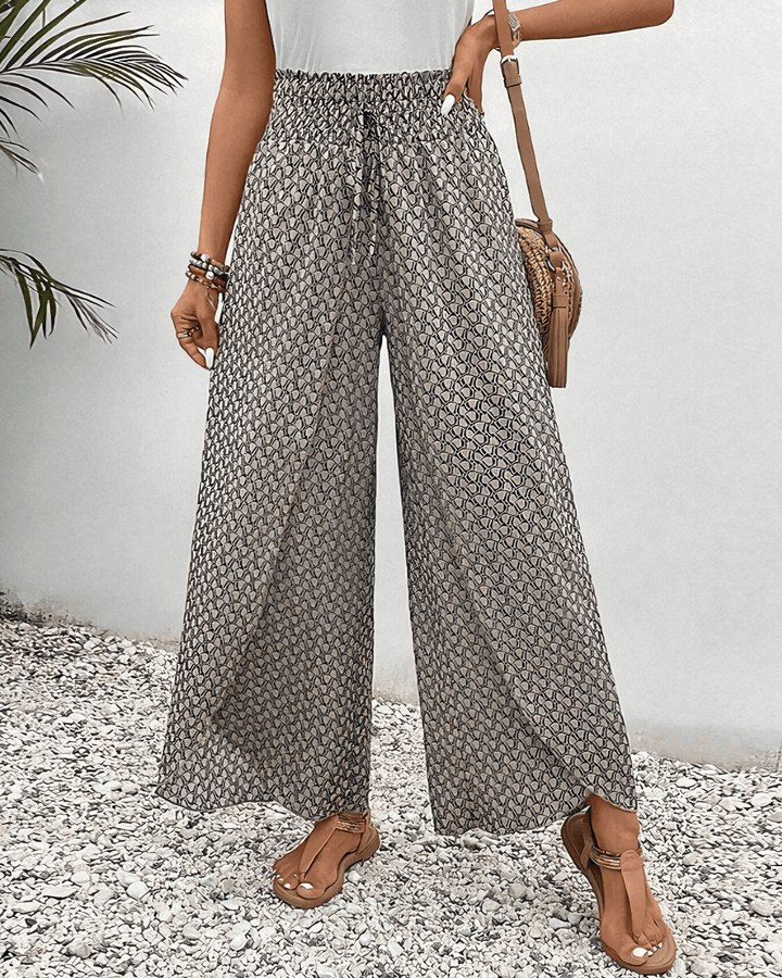 Women's flowy wide-leg pants in a comfortable viscose blend, perfect for stylish casual wear.