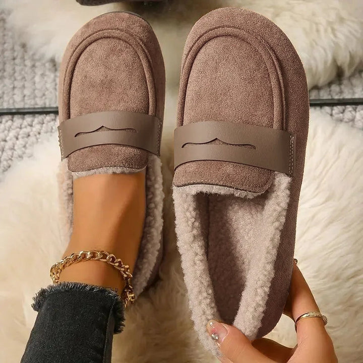 Luxurious fluffy lined women's penny loafers, a chic and comfortable flat shoe for fall.