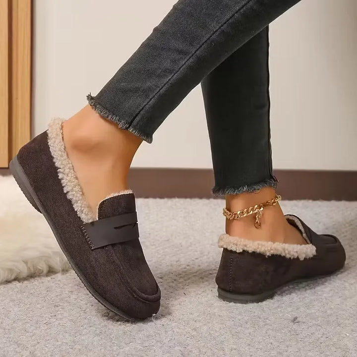 Soft fluffy lined women's slip-on penny loafers, fashionable and comfortable for casual wear.